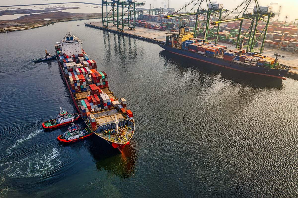 Goods container ship docking.