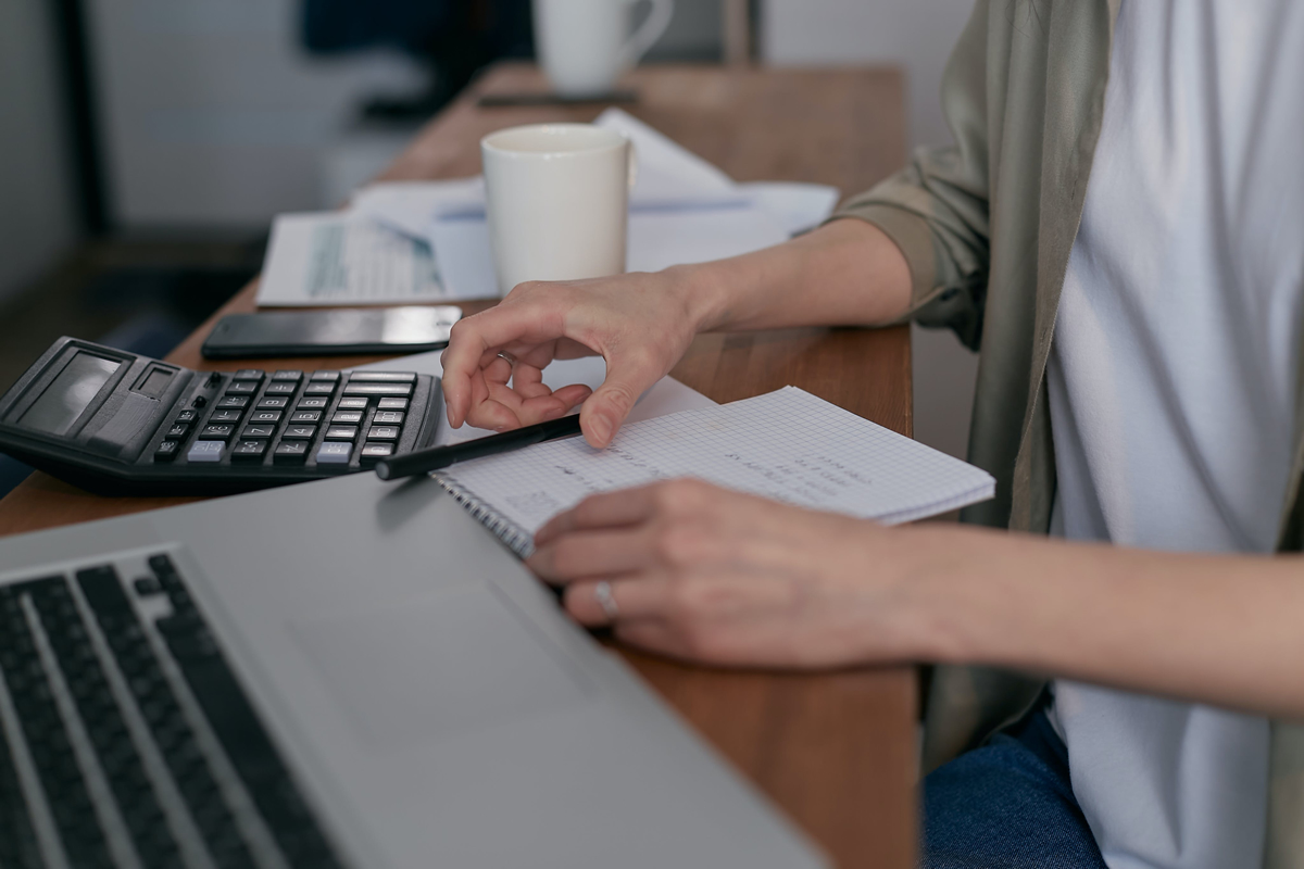 Person at a desk with a notepad